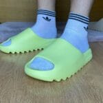 Yeezy Slide Glow Green on feet, photo by Reddit user u/ZeligD