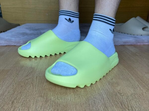 Yeezy Slide Glow Green on feet, photo by Reddit user u/ZeligD